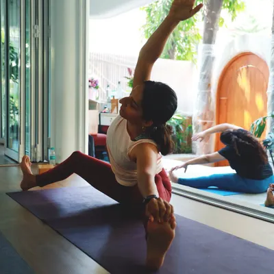 Finding the balance between effort and ease in Parivrtta Janu Sirsasana (Revolved Head-to-Knee Pose). This pose stretches the side body, hamstrings, and spine.