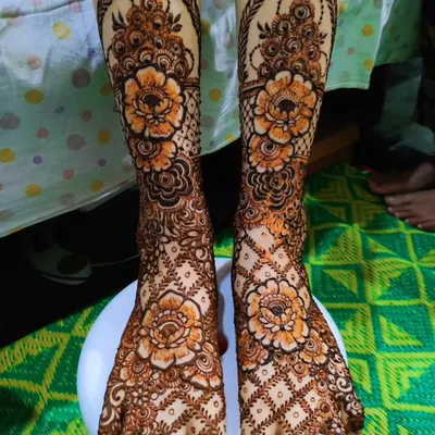 A classic bridal feet design featuring large floral motifs and detailed patterns covering the entire foot.