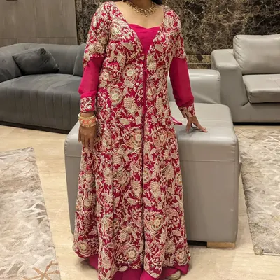 This two-in-one jacket gown is perfect for a destination wedding. Wear the heavy embroidered jacket for the ceremony and remove it for a simpler gown look at the reception.