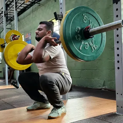 Excellent mobility is the foundation of true strength. Here, one of our members demonstrates a deep front squat, showcasing the flexibility and control we drill into every athlete. This is what proper form looks like.