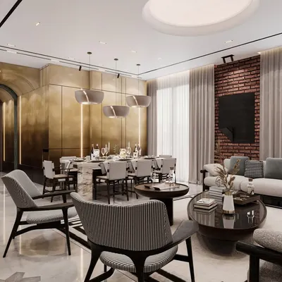 This open-plan living and dining area is defined by a striking brass-paneled wall that adds warmth and luxury. We used a mix of neutral tones, an exposed brick accent, and sleek, modern furniture to create a space that is perfect for both entertaining and relaxing.