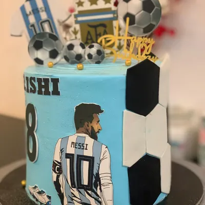 A Lionel Messi and Argentina themed football cake. This is perfect for a fan, featuring his jersey, the AFA logo, and edible soccer balls.
