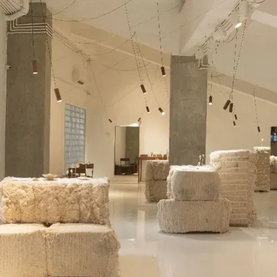 The exhibition landscape we designed for Studio Renn's fine jewelry collection. We used bales of raw kala cotton to create pedestals and partitions, creating a soft, primal environment that contrasts with the precious, formed jewelry.