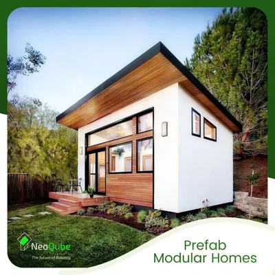 A prime example of our prefab modular homes, featuring a mix of white stucco and natural wood cladding. This design emphasizes a strong connection to the outdoors with its large glass facade and elevated deck.
