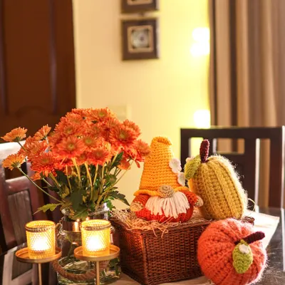 The 'ber' months bring the best colors. Here is a festive autumn tablescape featuring my Pumpkin Gnome, a crochet corn cob, and a plump orange pumpkin.