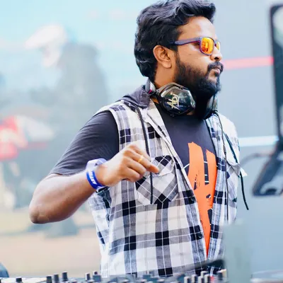 Focused and ready at the console during an outdoor day event. I adapt my music and energy to fit the venue and time of day, whether it's a sundowner session or a late-night party.