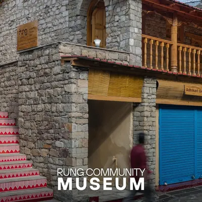 The entrance to the Rung Community Museum, where restored stonework and traditional painted steps welcome visitors into a space reborn from a historic dharamshala.