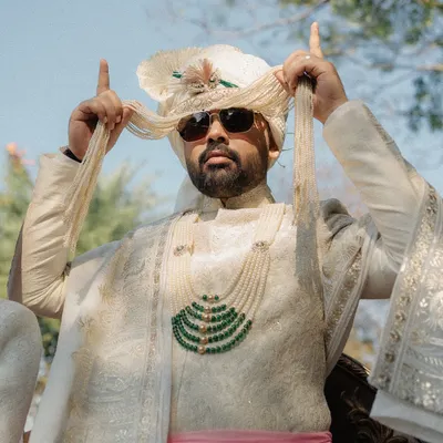 Vibe check: 100 percent baraat madness! Capturing the groom's energy and style as he makes his way to the wedding.
