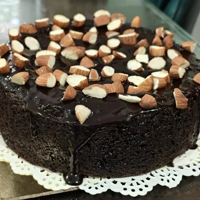 This beautiful almond-topped chocolate cake is a perfect example of healthy indulgence. The rich chocolate flavour comes through without any sugar, maida, or butter, making it an ideal guilt-free treat for your next celebration.