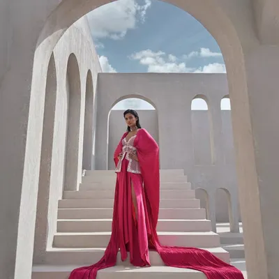 Like light through a prism, this hot pink ensemble carries the energy of movement and the brilliance of transformation. It is fresh, striking, and unafraid.