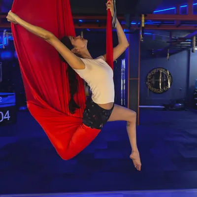 Experience a full-body workout that feels more like flying than exercise. This aerial pose opens up the shoulders and chest while engaging your core for stability.