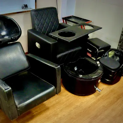 This is our dedicated station for ultimate relaxation. The setup includes a professional pedicure bowl with a foot bath and an ergonomic chair, designed to provide a comfortable and hygienic pedicure service.