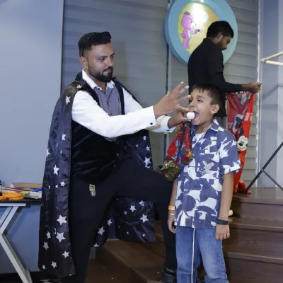Abracadabra. A magician captivates a young guest during one of our magic show add-ons. This interactive entertainment is always a highlight of the party.