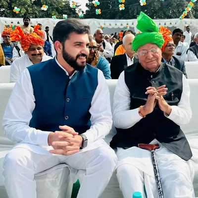 A candid moment with former Haryana Chief Minister, Shri Om Prakash Chautala, at a public event.