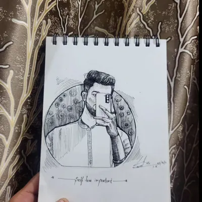 A self portrait sketch in my notebook with the note "Self love important". Art is a form of therapy for me, and sometimes a quick ink drawing is all I need.