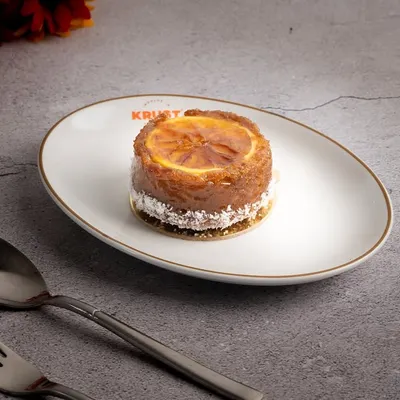 My vegan Orange Ginger cake, a plant-based version of our signature tea cake. It's just as moist, fragrant, and delicious, I pinky promise.