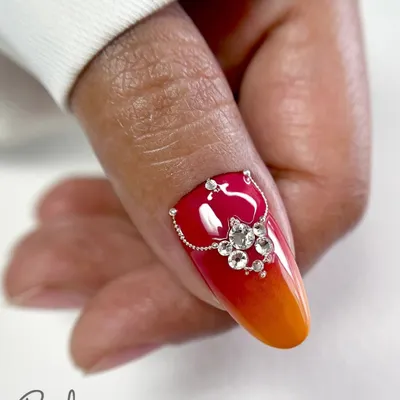 A close-up of the fiery ombre design with Swarovski crystal jewellery on a real nail. This is the kind of high-impact, luxurious look we create in my advanced courses.