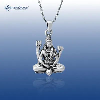 Our Lord Shiva pendant, shown in remarkable detail. This solid silver piece captures Mahadev in a meditative pose, complete with his Trishula and Damaru, as a symbol of divine strength.