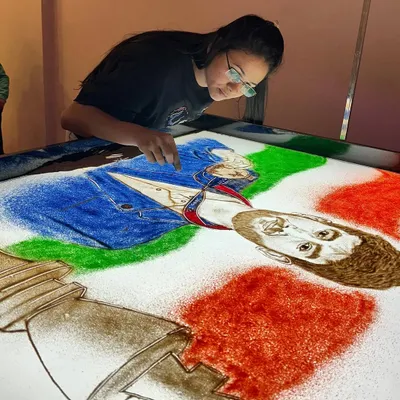 A sand art tribute to chess prodigy Gukesh Dommaraju, celebrating his championship win. I used colored sand to create a dynamic composition with the chess piece and his portrait.