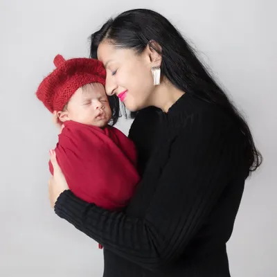 The purest love you will ever know. A mother's gentle touch and loving gaze at her newborn baby says everything.