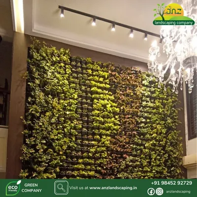 An elegant indoor vertical garden serves as a stunning feature wall. The dense arrangement of various plant types creates a rich tapestry of color and texture.