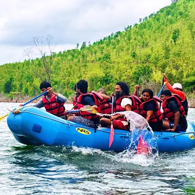 A team paddles in unison during our multi-activity camp at Vani Vilas Sagar. This shot captures the energy and teamwork required for rafting.