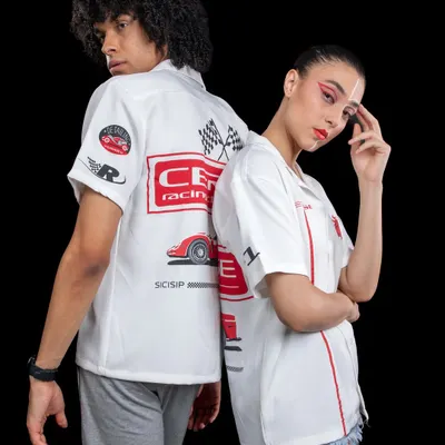 A back-to-back pose for Cerise Clothing, showing off the detailed graphics on their racing-themed shirts. This shot captures the brand's streetwear aesthetic for both men and women.