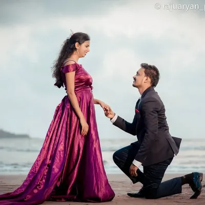 A classic proposal moment captured on the beach. The groom-to-be on one knee against the backdrop of the waves makes for a truly romantic and iconic pre-wedding photograph.