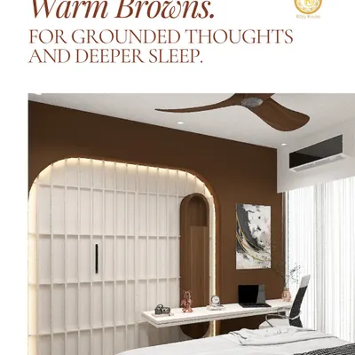 The warm brown accent wall in this bedroom is chosen specifically for its grounding properties, which Vastu suggests can lead to more settled thoughts and deeper sleep. Paired with a functional built-in desk and soft lighting, this room is a perfect blend of a productive workspace and a restful sanctuary.