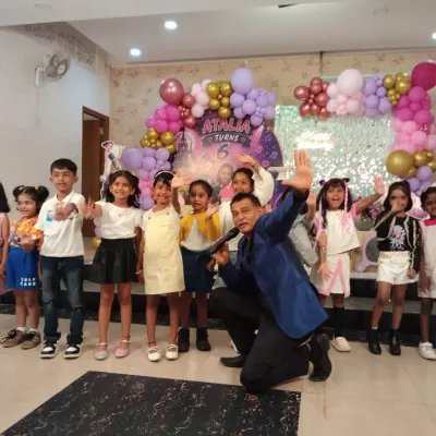 Posing with the stars of the show after a fun-filled session. Getting all the kids together for a happy picture is a great way to end the activities at a birthday party.