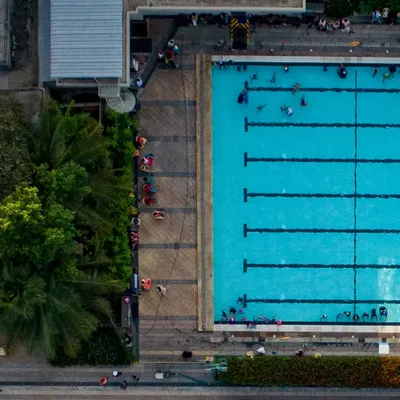 An aerial view of our swimming centre reveals the impressive scale and design of our pools. These shots showcase our clean, organized, and spacious environment, perfect for both training and leisure.