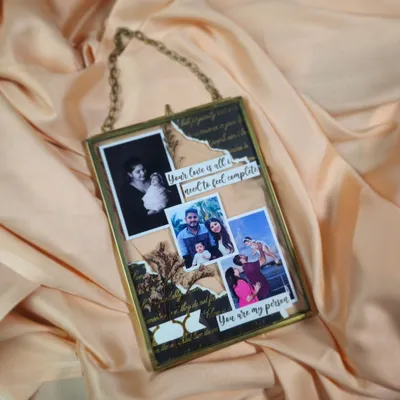 This custom glass floating frame is a beautiful way to display cherished photos. I arrange your pictures with quotes and decorative paper to create a unique, collage-style piece of art.