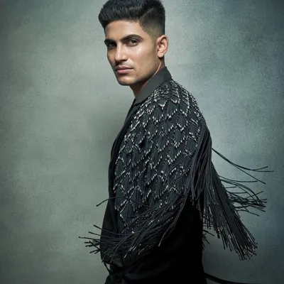 Styling Shubman Gill in this statement jacket with detailed fringe work. It’s a piece that adds movement and a bold texture, perfect for making an entrance.