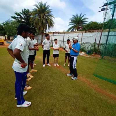 A team huddle before a session. I believe in talking to my players directly, setting expectations, and discussing the mental aspects of the game as a group.