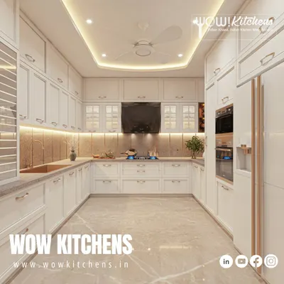 This all-white U-shaped kitchen is a timeless classic. It features profiled cabinet doors, elegant handles, a built-in oven tower, and a beautiful marble-patterned floor for a touch of luxury.