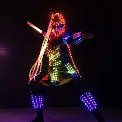 Our pixel warrior strikes a dynamic pose in a fully programmable LED suit. This costume can be customized with logos or specific color schemes for corporate events and brand activations.