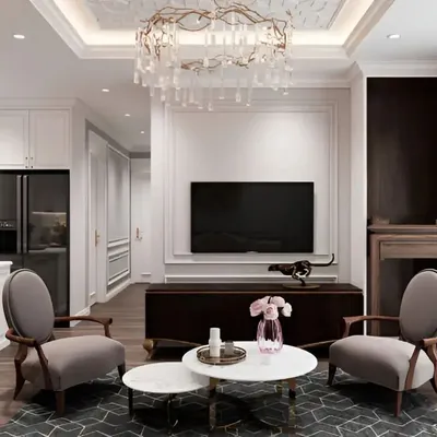 A neo-classical living room featuring elegant wall mouldings, a crystal chandelier, and a balanced furniture layout.