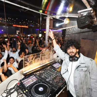 The view from my stage at Cafe Mambo. Seeing a crowd this happy and engaged, with everyone's hands up, is the ultimate reward for any DJ.