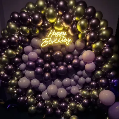 A full view of my popular birthday balloon wall, featuring a mix of metallic and matte balloons. The 'Happy Birthday' neon sign in the center adds a warm, celebratory glow that looks fantastic in photos.