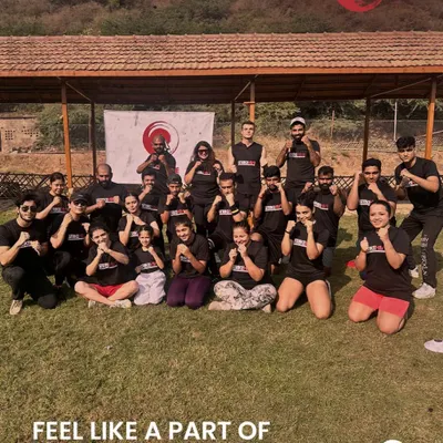 Our members and coaches pose together during an outdoor community event. These gatherings are essential for building the family-like atmosphere that makes StrikeHive a special place to train.