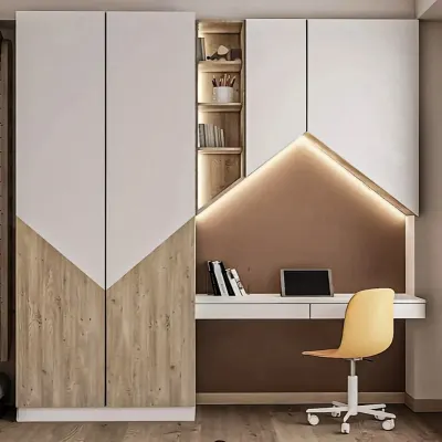 A space-saving modular unit that combines a full-height wardrobe with a compact study desk. The angled design and integrated lighting create a stylish and highly functional corner in a bedroom.