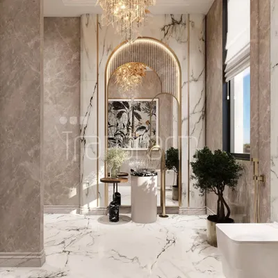 This spacious powder room is an ode to refined aesthetics. I used stunning marble surfaces, an arched mirror with gold accents, and layered lighting to create an illusion of grandeur and a playful, vibrant energy.