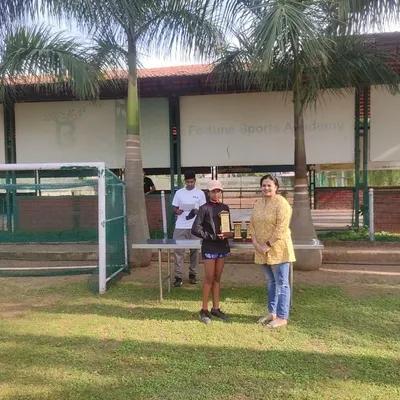 One of our U12 champions receives her award at the FSA KSLTA State Ranking Tennis Tournament in Bangalore. We ensure every event concludes with a formal prize distribution to recognize the hard work of all participants.