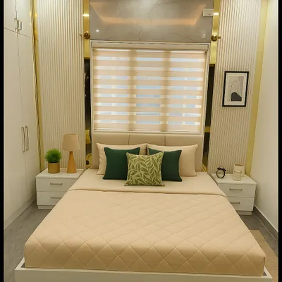 This modern contemporary bedroom combines soft neutral tones with luxurious gold accents. We used grooved wall panels, layered cove and spot lighting, and a low platform bed to create a cozy yet elegant ambiance.