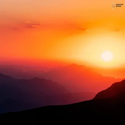 A fiery sunset over layers of mountains. This is the kind of magical view that makes you stop and just be present in the moment.