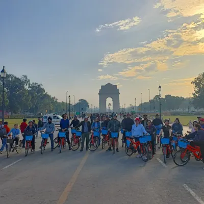 There's no better way to see the full expanse of Lutyens' Delhi than from the seat of a cycle. Our group pauses on Kartavya Path for a classic photo with India Gate in the distance.