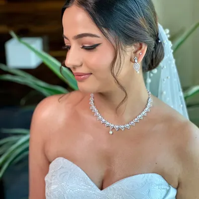 A portrait of my graceful Christian bride, Beracah. Her look was all about soft glam, with a sharp winged liner and glowing skin that radiated pure elegance in her white wedding gown.