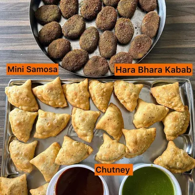 A classic party starter combination of crispy Mini Samosas and flavorful Hara Bhara Kebabs, served with sweet and spicy chutneys.