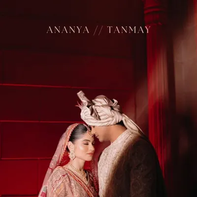 A dramatic and intimate couple portrait, using bold red lighting to create a passionate and cinematic feel for this royal wedding shot.