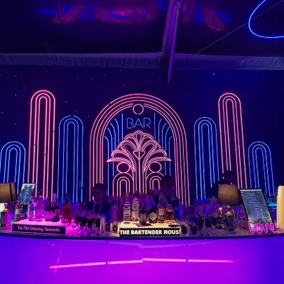 This stunning Art Deco neon bar was the centerpiece of a glamorous sangeet. We design our bars to be more than just functional; they are a core part of your event's decor and aesthetic.